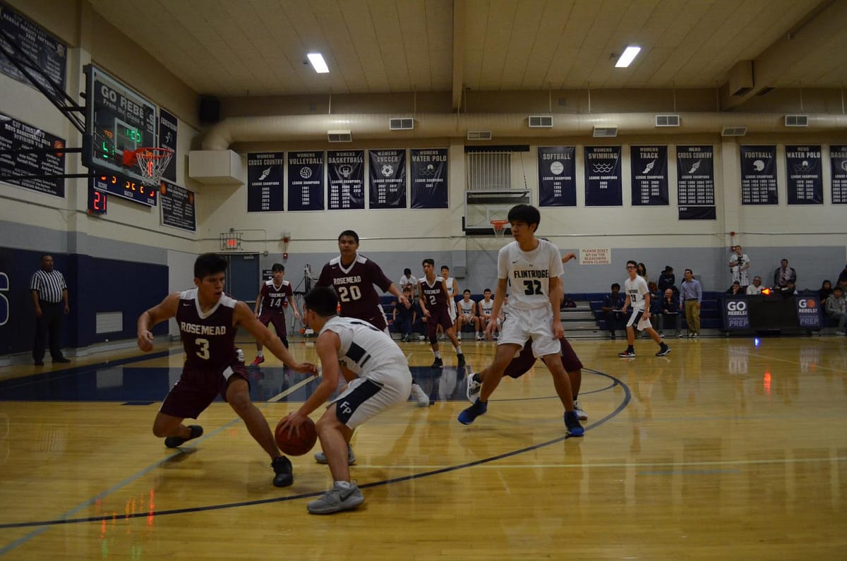 Zach Luu '21 and Torres Shi '19 run a pick and roll play.