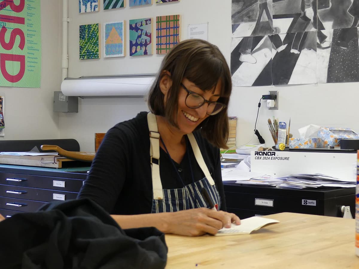 Ms. Manfull, AP Studio Art teacher, draws along with her class.