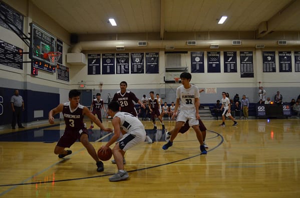 Zach Luu '21 and Torres Shi '19 run a pick and roll play.